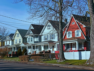 Street of older detached houses with gables