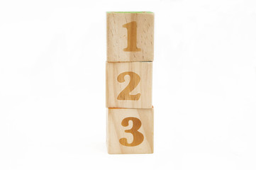 wooden blocks stacked with the numbers 123 isolated on white background - obrazy, fototapety, plakaty