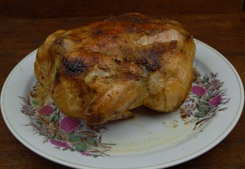  chicken with a beautiful fried crust lies on a plate