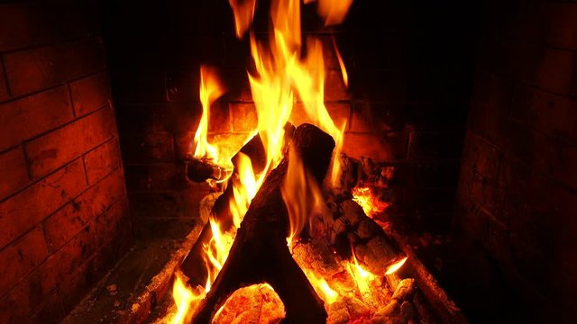 Video of cosy fireplace with reddish fire during Christmas holidays