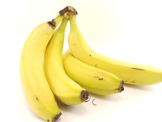 ripe yellow bananas on a white background