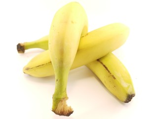 ripe yellow bananas on a white background