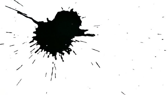 Black spot on a white background. Dripping ink drops on a white piece of paper.