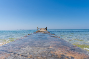 Wooden bridge in the middle of the ocean