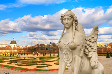 Fototapeta na wymiar City landscape - close-up view of the Sphinx sculpture on the background of the Belvedere Gardens in the city of Vienna, Austria