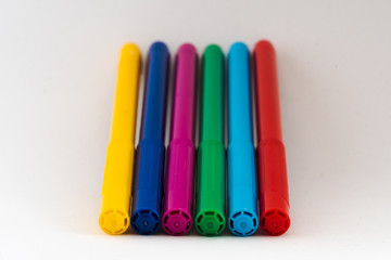set of multicolored felt tip pens on white background