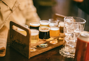 Fototapeta na wymiar Close up of craft beer tasting flight on a bar table