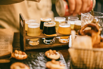 Close up of Beer Tasting Flight with onion rings