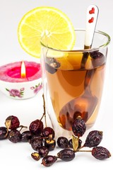 Rosehip tea. Alternative treatment for colds and flu. Dried rosehip. Glass with rosehip tea. Treatment of chills. Medicinal plants.