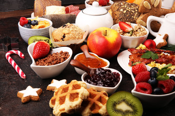 Breakfast served with coffee, orange juice, croissants, cereals and fruits. Balanced diet. Continental breakfast on christmas