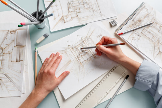 Interior designer making hand drawing pencil sketch of a bathroom