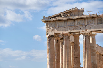 Columns and sculptures of the Parthenon in Acropolis, Athens, Greece.      