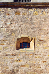 window in an old stone wall