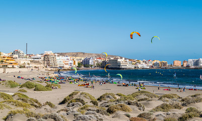 El Médano beach on the Southern Coast of Tenerife with a colorful crowd of kitesurfers.