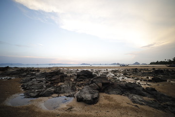 Sunset in the beach with a boat, Thailand 