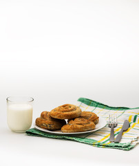Domestic Home made Rolled pastry with spinach and cheese on a napkin with a glass of Yogurt