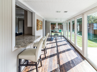 Workspace in Sunroom with Natural Light and Modern Remodel