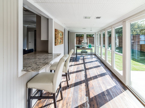 Workspace in Sunroom with Natural Light and Modern Remodel