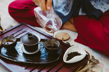 Tea master pours Chinese tea.