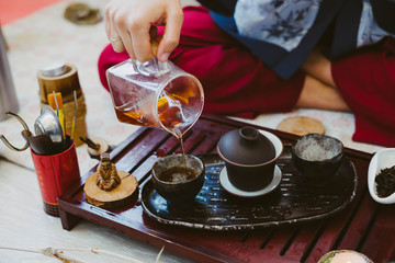 Tea master pours Chinese tea.