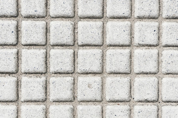 Gray concrete pavement grid texture.