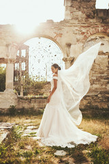 Bride in wedding dress on background of old european city