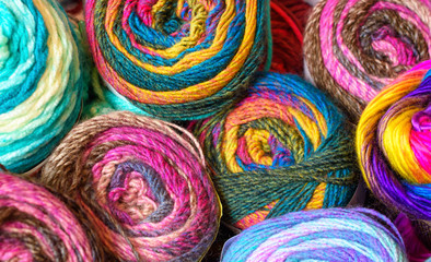 Multiple Vivid Variegated Skeins of Yarn