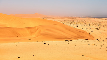 Fototapeta na wymiar Desert, ocean and sky in Namibia.