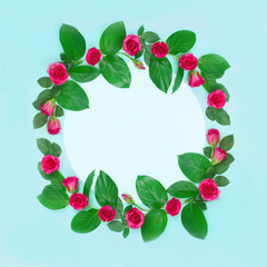 Wreath of roses with leaves and empty space inside on a blue background.Beautiful greeting card Valentine's day, Wedding, birthday, mother's day. sale