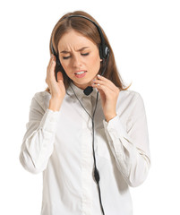 Troubled female technical support agent on white background