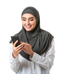 Beautiful Arab woman with mobile phone on white background