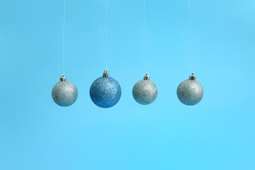 Beautiful Christmas balls on color background