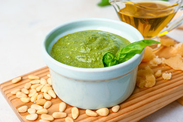 Pesto sauce in bowl on table