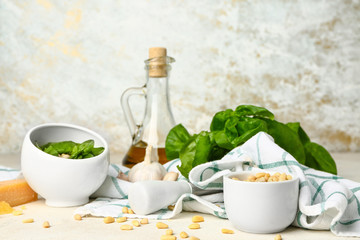 Ingredients for pesto sauce on light background