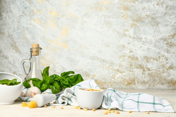 Ingredients for pesto sauce on light background