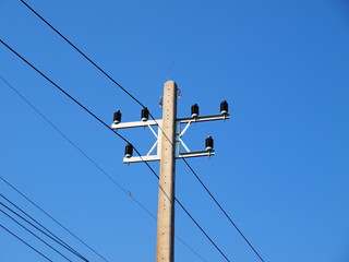 New electricity poles and high voltage cables on the poles Replacing the electric pole With a new...