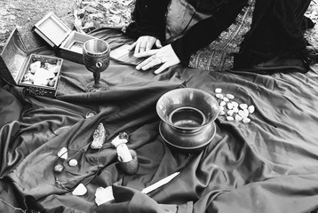 Solitary witch preparing an altar