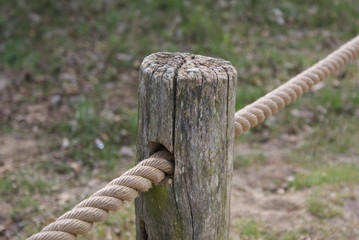 wooden with rope fence in garden