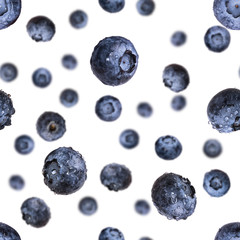 Seamless pattern with falling fresh blueberries isolated on white