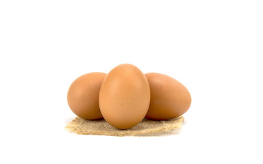 chicken egg isolated on sack cloth  and white background.