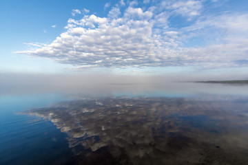 Clouds and fog at dawn. Pskov region. Russia