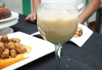 hand with glass of white wine