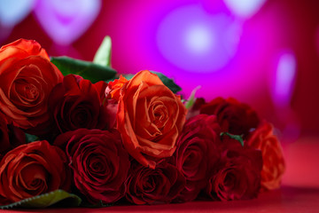 Red roses on a red background, Love and romance. Holiday