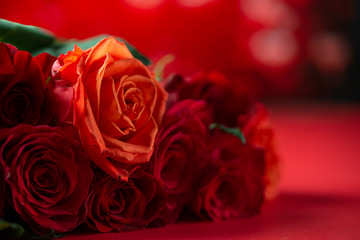 Bouquet of red roses, congratulations on Valentine's Day or mother's day, or March 8. Red background