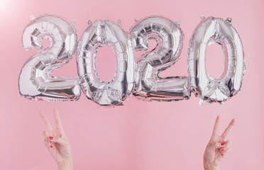 2020 balloon celebrate happy new year background banner or card on bright pink, golden and silver color theme