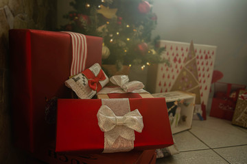 Christmas morning: gifts next to the pine tree