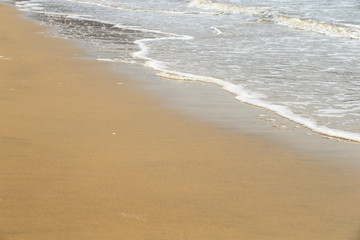Golden sandy beach. Golden sandy beach with calm waves.