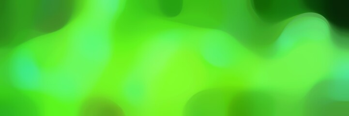 blurred iridescent horizontal background texture with moderate green, very dark green and forest green colors and space for text or image