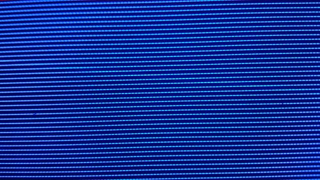 Close-up of the Monitor's Pixels. RGB pixels on the TV during the screening of the film, macro, close-up. Red, blue and green sub pixels create an image on the screen