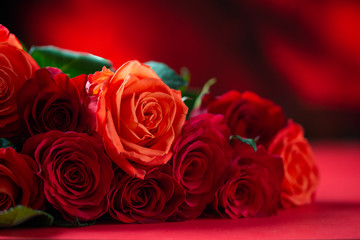 Congratulation on Valentine's Day, roses, flowers, romance. Red background, space for an inscription.